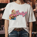 Dolly Parton Retro Cartoon Guitar T-Shirt with pink script lettering
